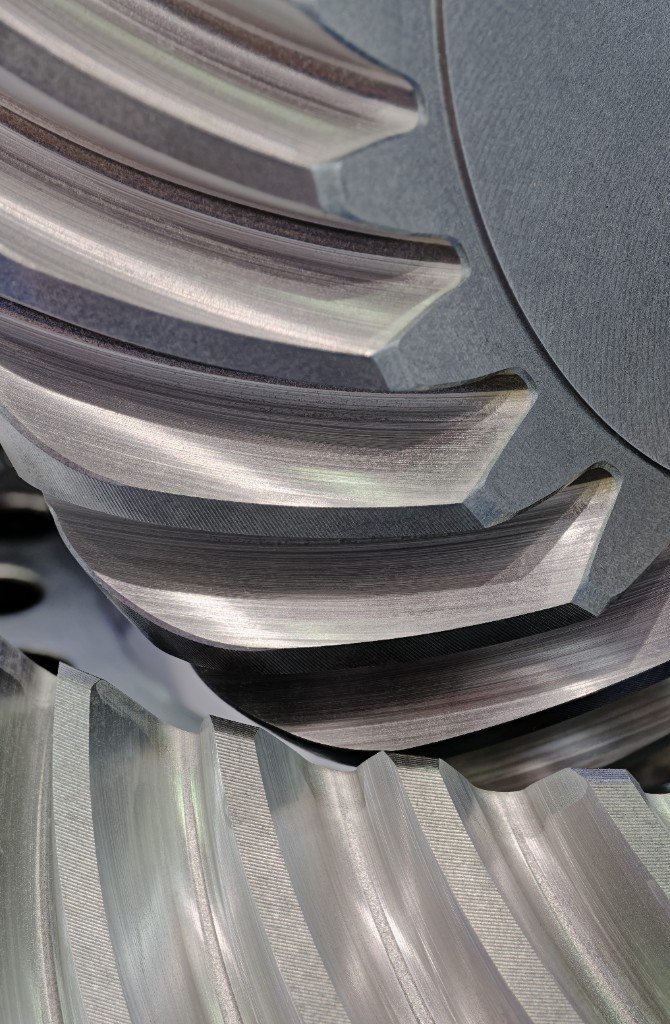Macro view of meshing bevel gear teeth showing micron-level surface finish